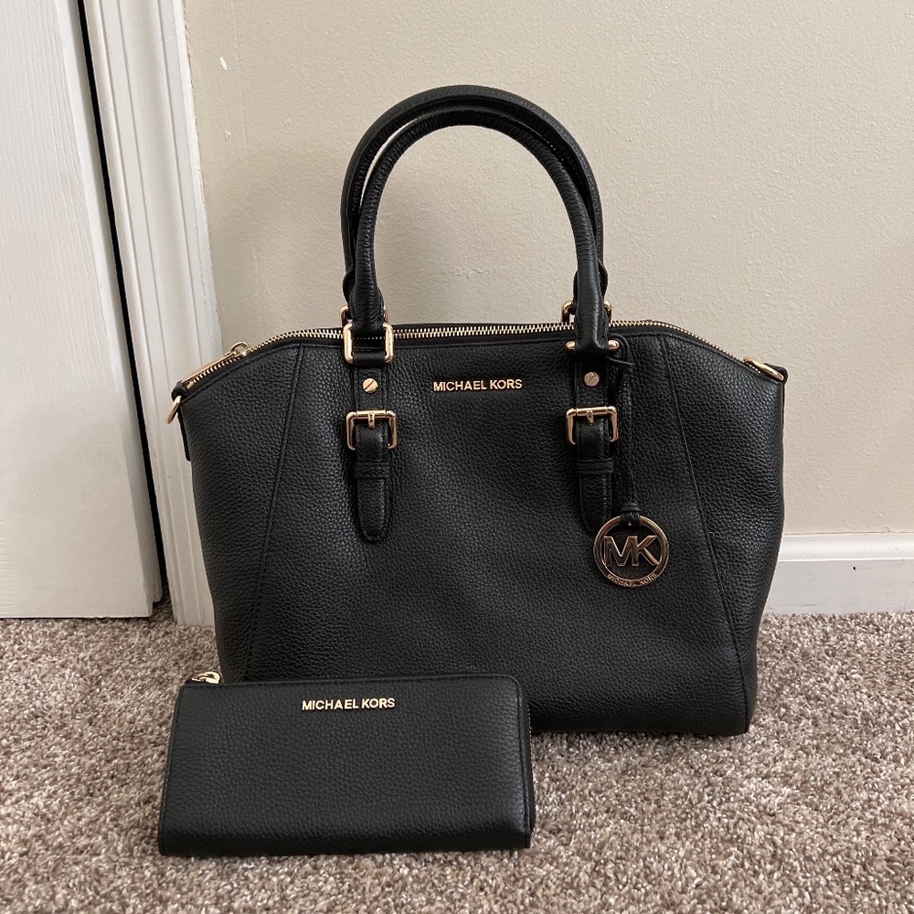Black Michael Kors Purse And Wallet set.